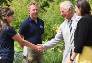 The-Prince-of-Wales-meets-gardener-Emma-Bouchard-with-gardener-Paul-Eaton-and-garden-designer-Marie-Louise-Agius-right-in-the-Centenary-Garden