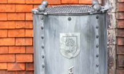 Arthur Jack & Co - RHS round water butt against a red tiled wall